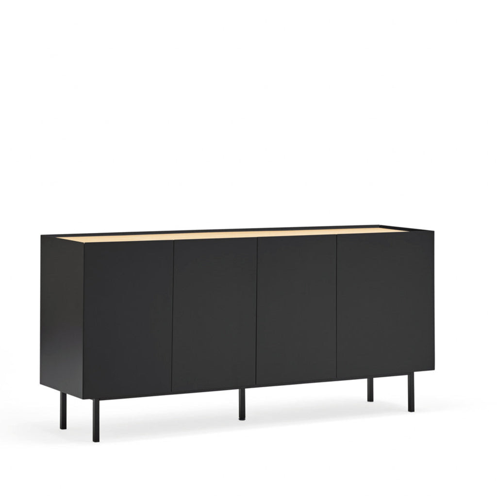 A modern sideboard cabinet with four black doors, slim black legs, and a light natural wood top, shown against a plain white background.