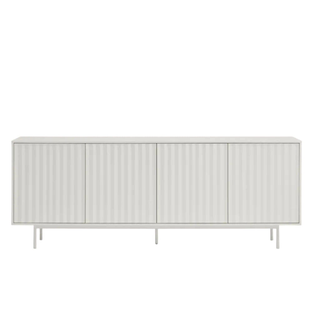 A modern sideboard cabinet with four vertically ribbed doors in a light gray finish, supported by slim metal legs, shown against a plain white background.