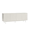 A long, low sideboard cabinet with four vertically ribbed doors, shown in a light warm gray or off-white finish on a clean white background.