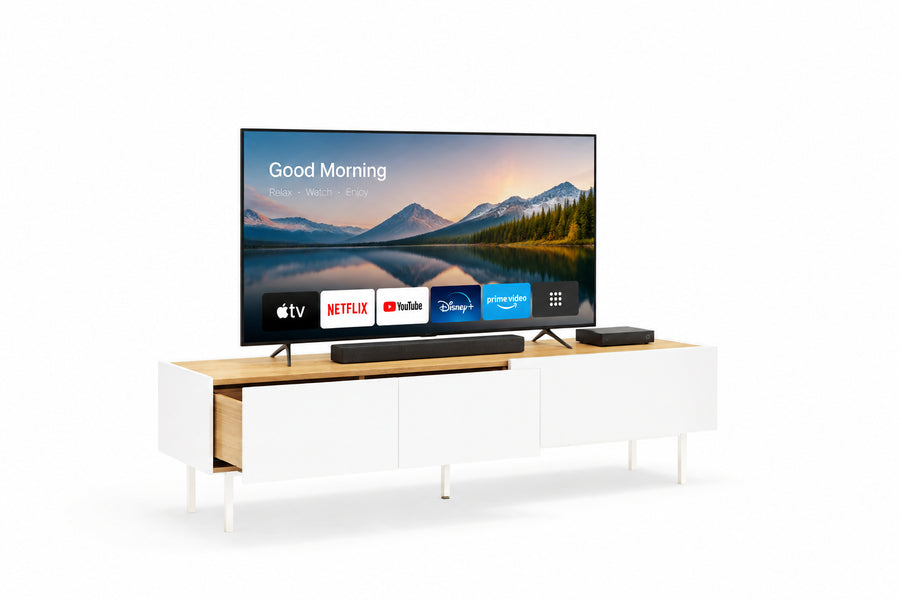 A two-drawer, one-door TV unit with a matt white body and light oak finish top, featuring soft-close drawers and a drop-down door with gas pistons.