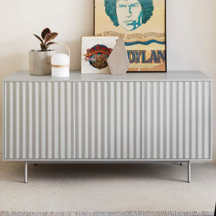 Modern sideboard with decorative items in a minimalistic room