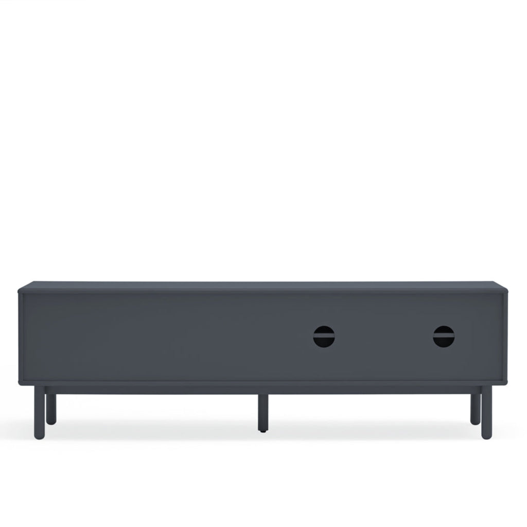 A modern dark gray media console or TV stand with a rectangular front, two circular cutout details on the front, and four slim legs, shown against a plain white background.