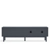 A modern dark gray media console or TV stand with a rectangular front, two circular cutout details on the front, and four slim legs, shown against a plain white background.