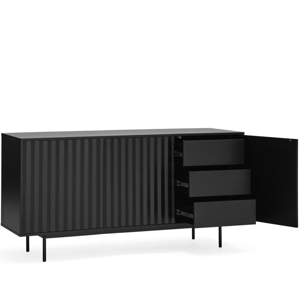 A modern black sideboard cabinet with a ribbed front panel, three drawers on the right, and an open door, shown on a plain white background.