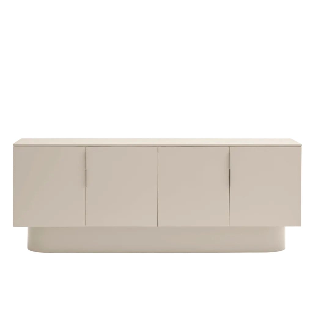 A modern low-profile sideboard or credenza with four tall rectangular doors and slim vertical handles, shown against a plain white background.