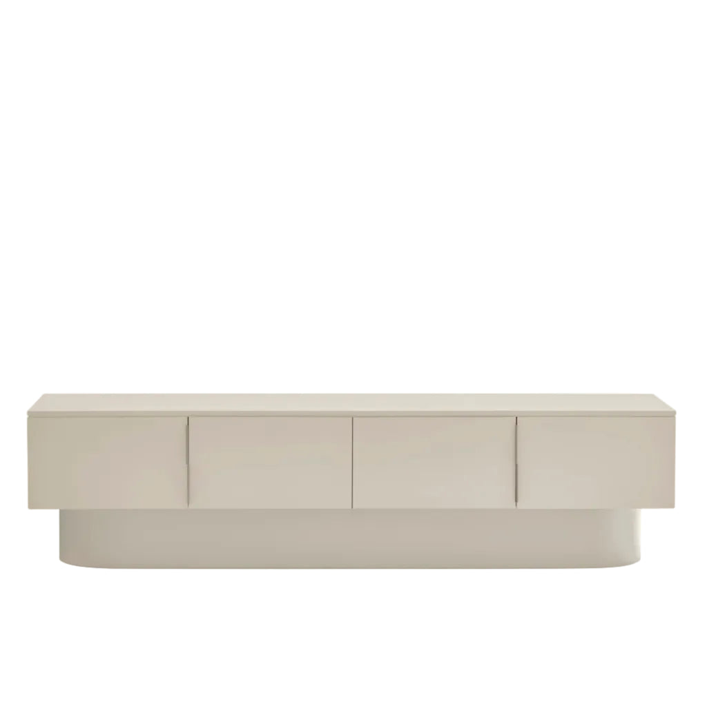 A modern low-profile sideboard or credenza in a light beige finish, featuring four cabinet doors and a matching rounded base, shown against a plain white background.