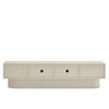 A modern low-profile media console or sideboard in a light warm beige finish, featuring two front-facing drawers with small round black knobs and a sculptural tiered base, shown against a plain white background.