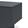 A close-up studio shot of a modern dark gray side table with a cylindrical pedestal base and a flat rectangular top, shown against a plain white background.