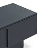 Close-up of a modern dark charcoal gray sideboard or cabinet with a minimalist linear design, featuring a vertical handle and a clean top surface, set against a plain white background.
