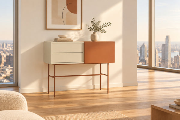 A modern console table with two drawers and a sliding door, finished in light sand and red brick, with metal legs also in red brick.