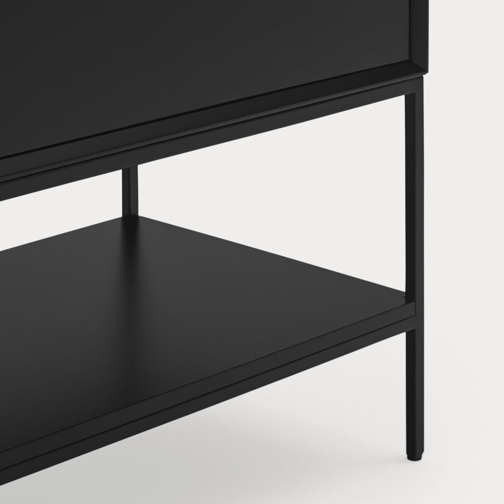 Close-up of a black wooden cabinet or shelf unit with a single drawer and an open lower shelf, shown against a light gray background.