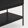 Close-up of a black wooden cabinet or shelf unit with a single drawer and an open lower shelf, shown against a light gray background.