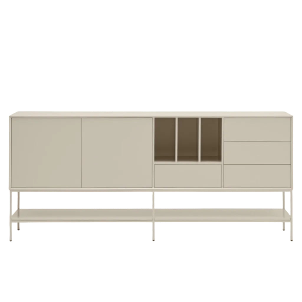 A modern sideboard cabinet with a light beige finish, featuring two large doors, a central open cubby, three drawers, and a lower open shelf on a slim metal frame, set against a plain light gray background.