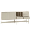 A modern sideboard cabinet with a minimalist design, featuring two large doors, open cubbies, three drawers, and a lower open shelf on slim metal legs, shown against a plain light gray background.