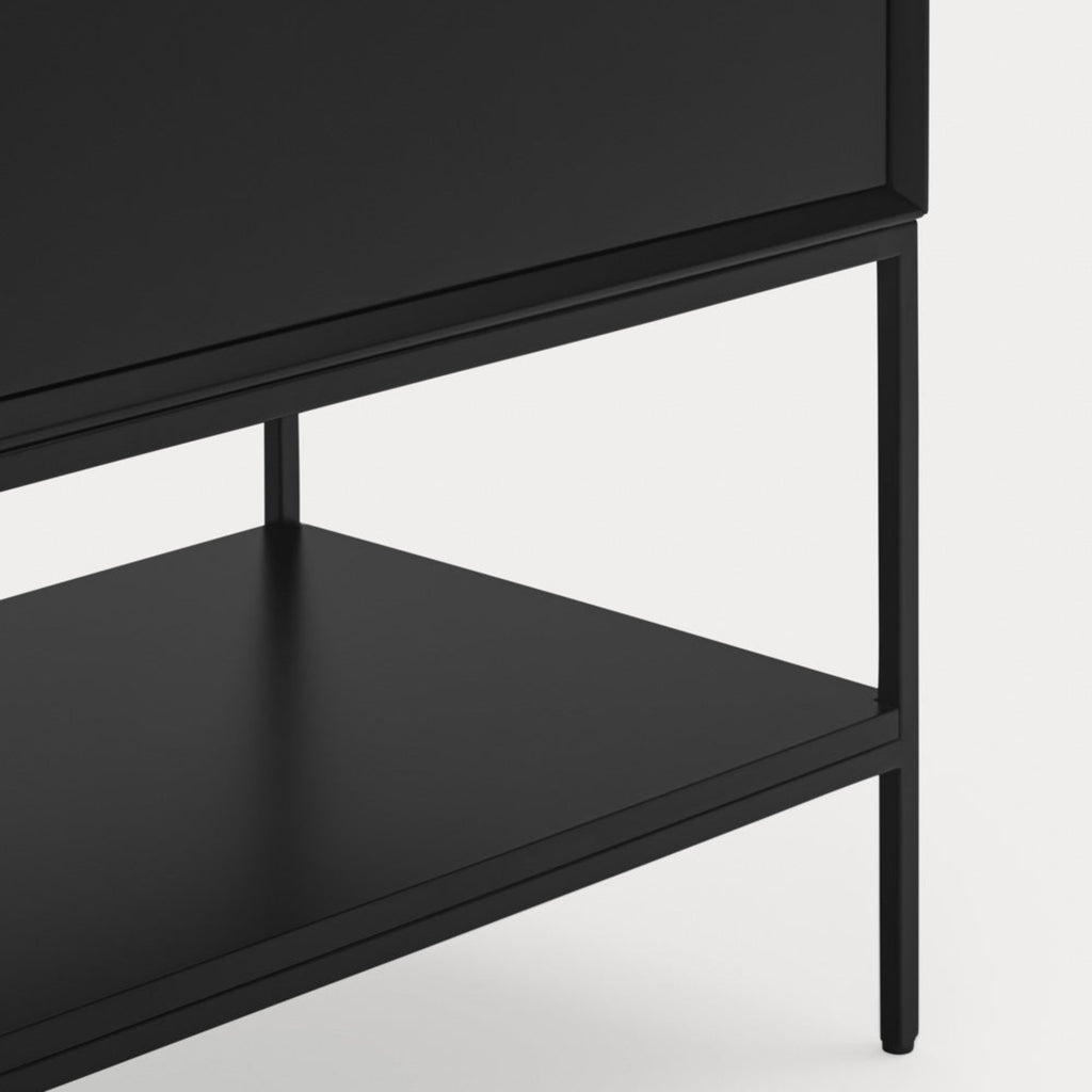 Close-up of a black wooden cabinet or shelf unit with a single drawer and an open lower shelf, shown against a light gray background.